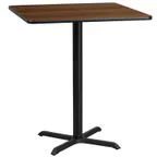 image of Flash Furniture XU-WALTB-3636-T3030B-GG 36x36 Walnut Laminate Bar Height Table, 43-1/8H, MDF Top, Black PVC Edge, Cast Iron Base