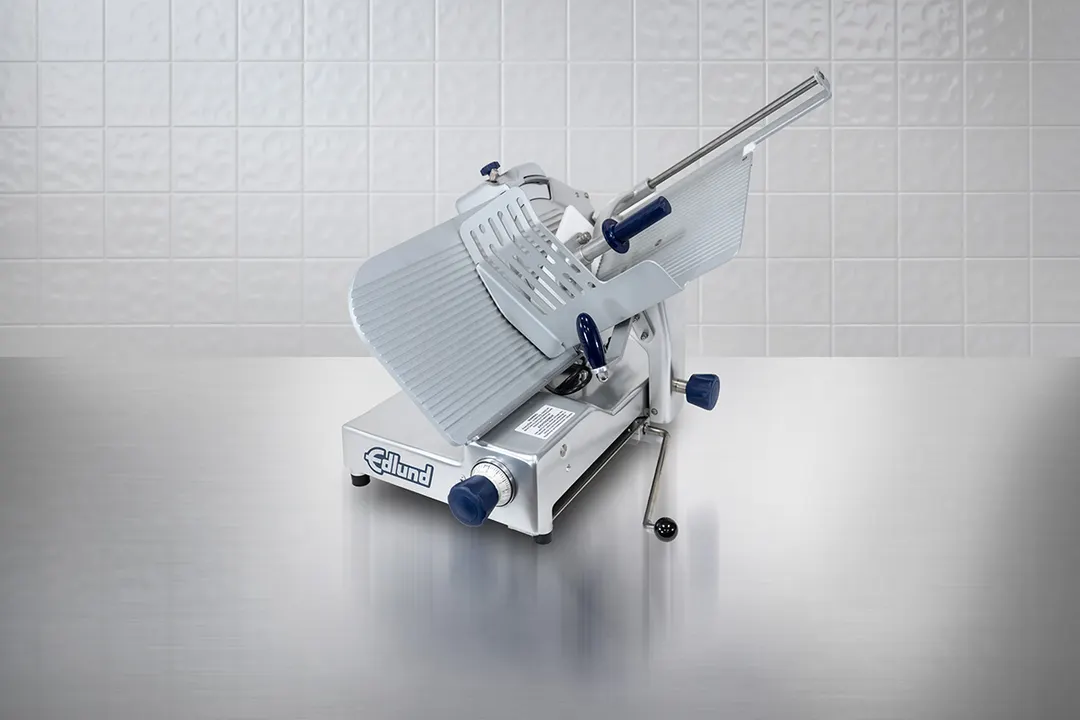Edlund EDV-13 Edvantage Meat Slicer – 13” forged carbon steel blade, gravity feed, 33”L x 22.5”W x 27.5”H, 115V 1/2HP
