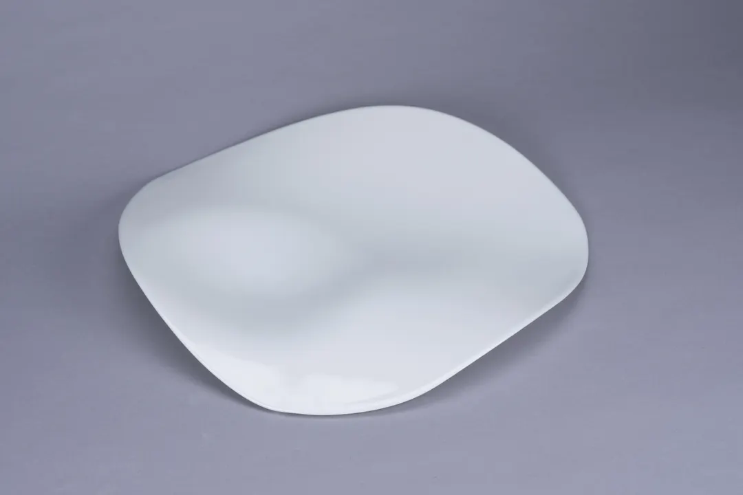 RAK Porcelain BCFSASP2Z30 - 11.7" Wave Bone China Plate, White, Asymmetric Two‑Zone - 6/Case