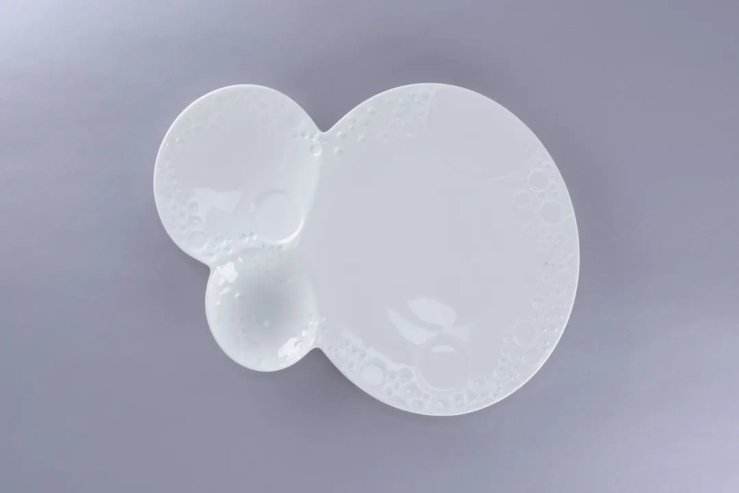 RAK Porcelain BCFSBBOP3IN29 - 12" Free-Form Bone China Plate White Three-Zone Design - 12/Case