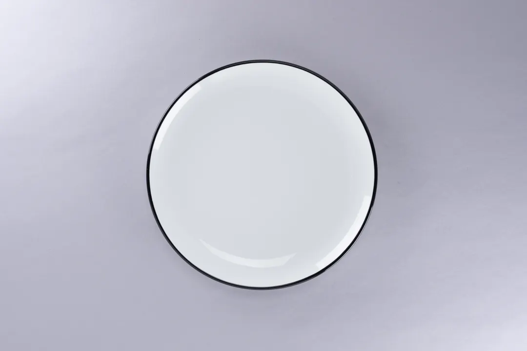 RAK Porcelain ONPR24CD25147 Coupe Plate, 9.45" Diameter Round White Porcelain Black Rim - 12/Case