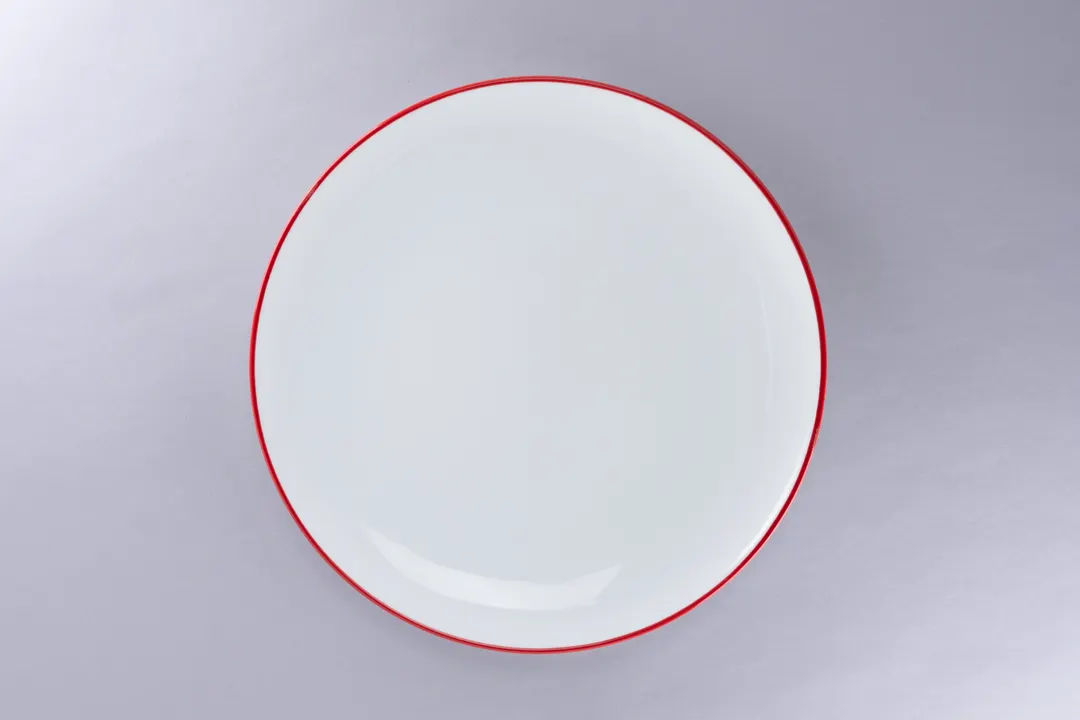 RAK Porcelain ONPR29CD25146 - 11.4" Round Rim China Plate, White with Red Rim, 12/Case