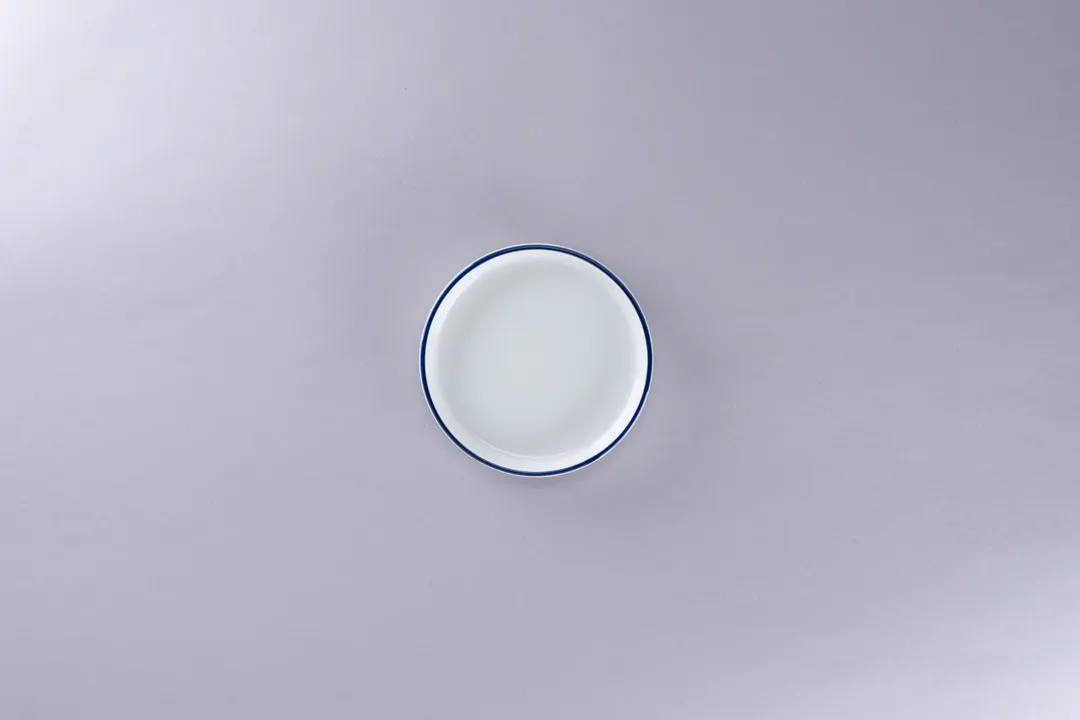 RAK Porcelain PLNOLD12CD25145 Plate, 4.7" Diameter White with Blue Rim, Rimless Edge - 12/Case
