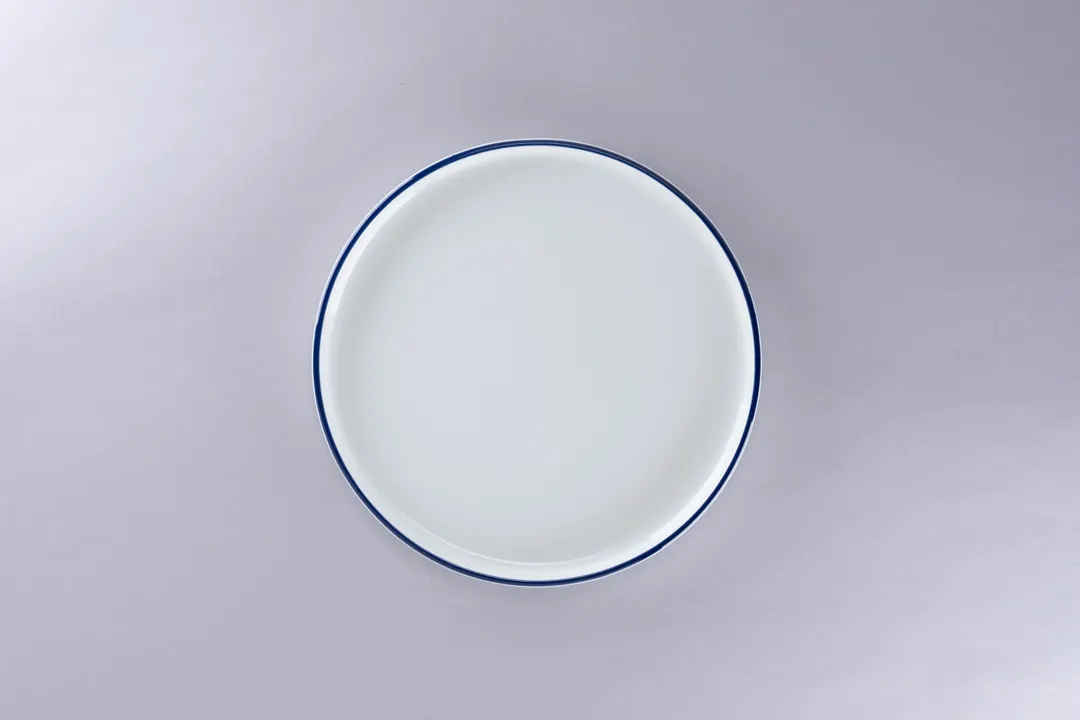 RAK Porcelain PLNOLD23CD25145 Stackable Rimless Plate, 9.1" Round Blue Rim, Porcelain - 12/Case