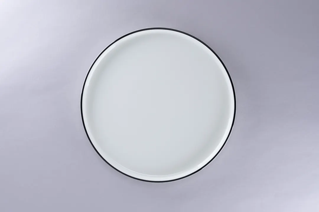 RAK Porcelain PLNOLD27CD25147 - Round 10.62" Stackable Rimless Plate, White Black Rim, Porcelain