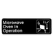 Thunder Group PLIS9324BK Information Symbol Sign, 9" X 3" "Microwave Oven In Operation", Self-Adhesive Backing 1 image